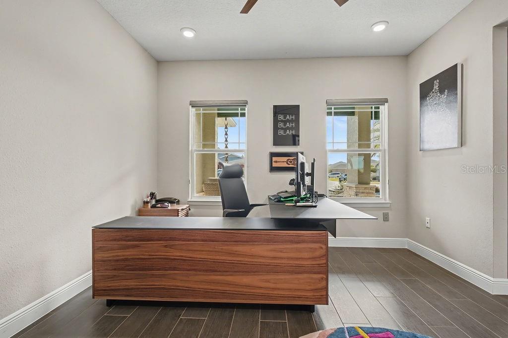 9963 Southwest 82nd Street Road Ocala, FL 34481 - Photo 5 of 43 a view of room with window and wooden floor