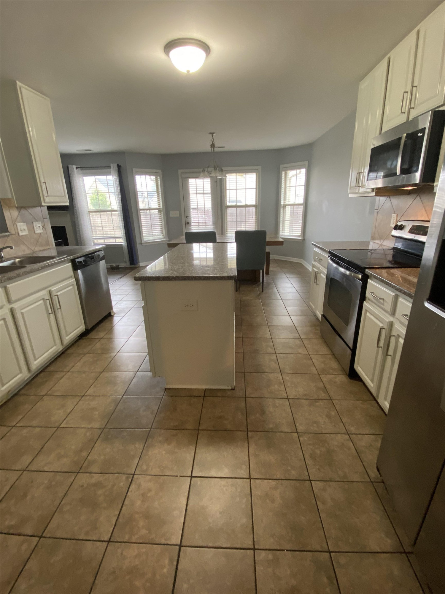 95 Red Coat Drive Cameron, NC 28326 - Photo 12 of 35 a living room with furniture a flat screen tv and a stove