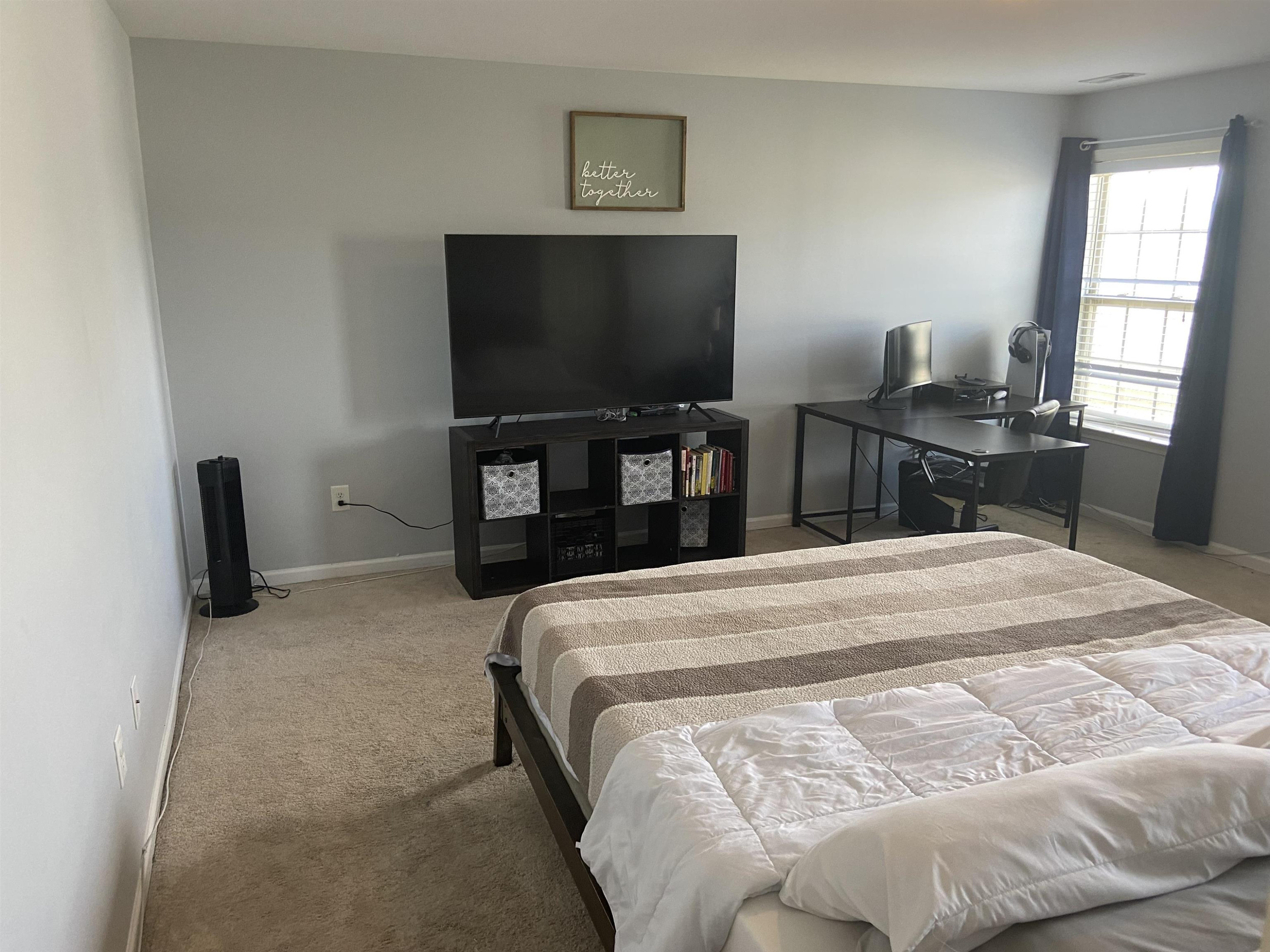 95 Red Coat Drive Cameron, NC 28326 - Photo 16 of 35 a bedroom with a bed and a flat screen tv