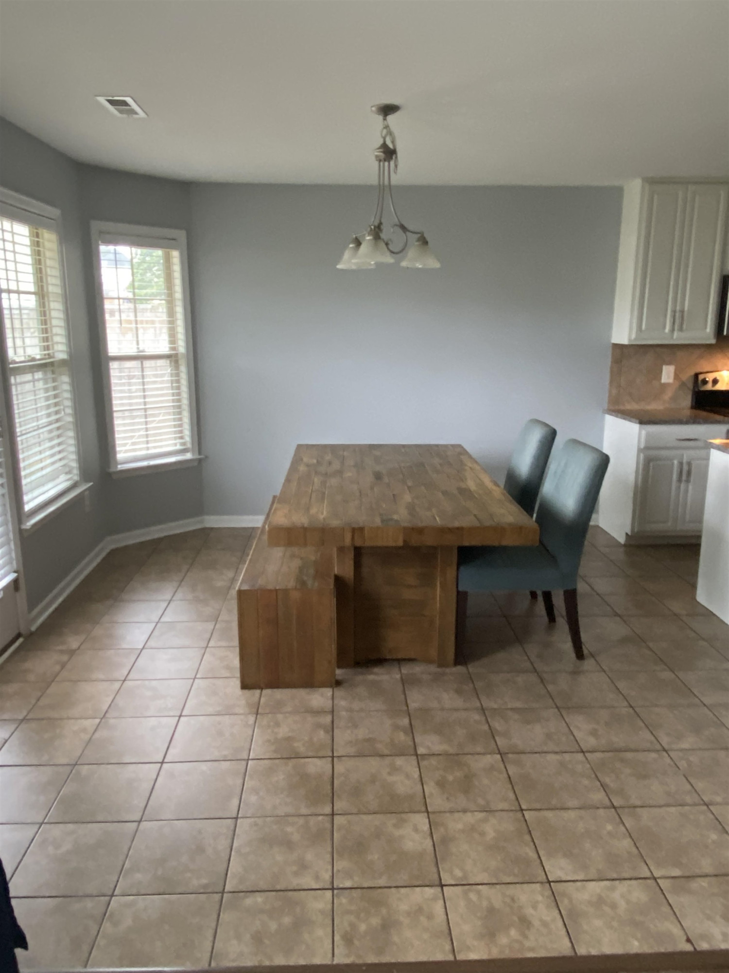 95 Red Coat Drive Cameron, NC 28326 - Photo 10 of 35 a living room with a table chairs and a stove