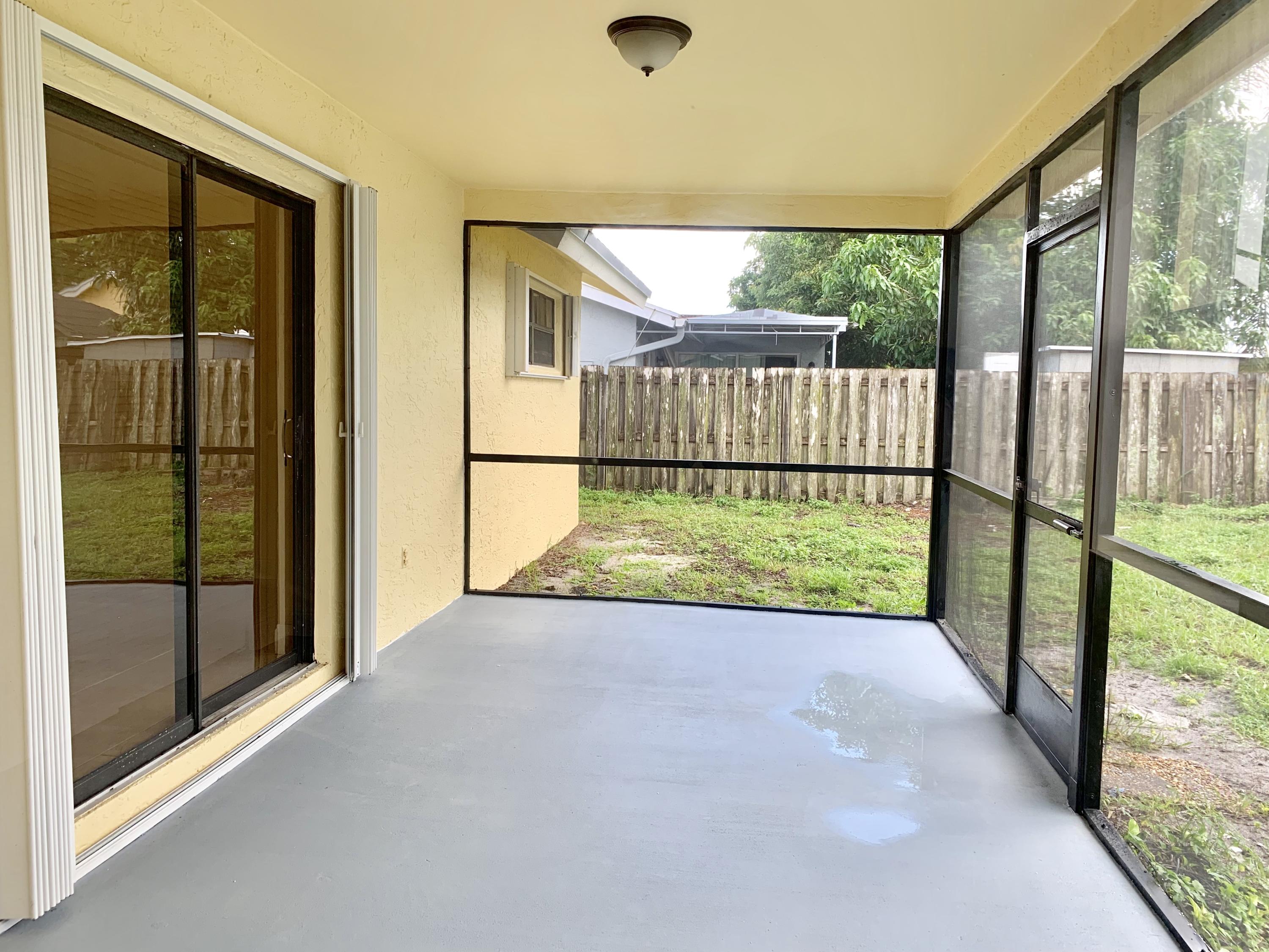 23247 Southwest 60th Avenue Boca Raton, FL 33428 - Photo 4 of 26 Cover Patio