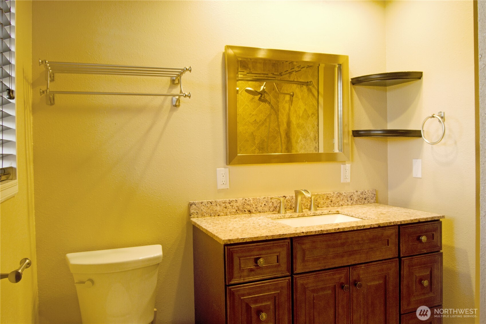 393 Flora Place Forks, WA 98331 - Photo 23 of 26 a bathroom with a sink and a mirror