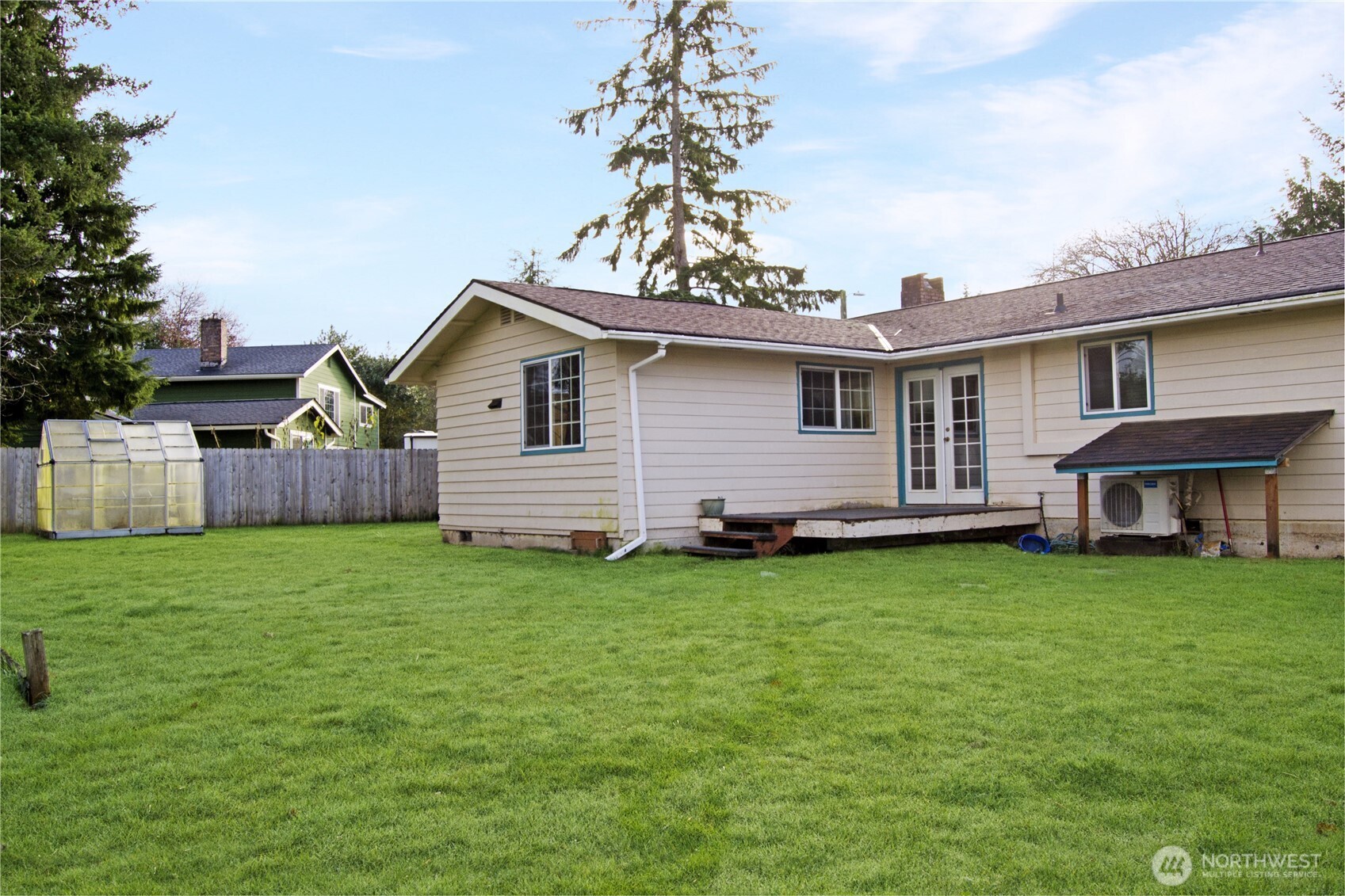 393 Flora Place Forks, WA 98331 - Photo 4 of 26 a front view of a house with garden