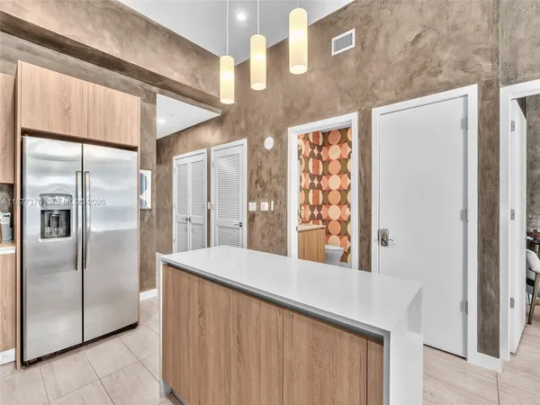 a balcony view with a couch and wooden floor