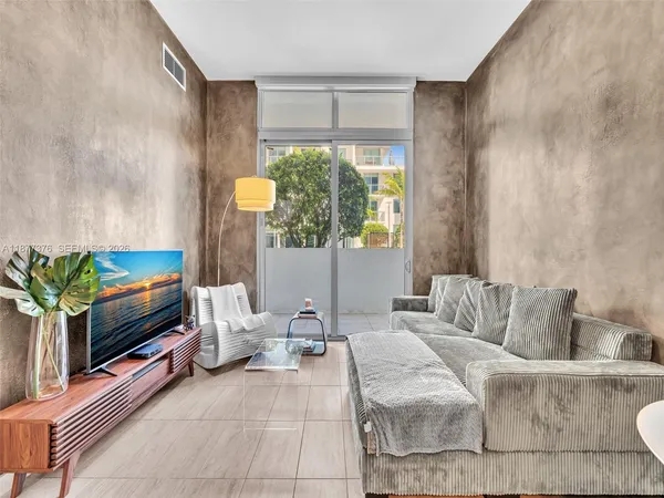 a balcony view with a seating space