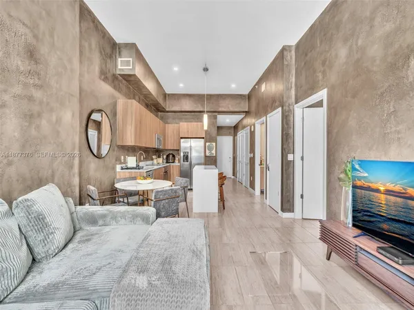 a bedroom with bed and a couch