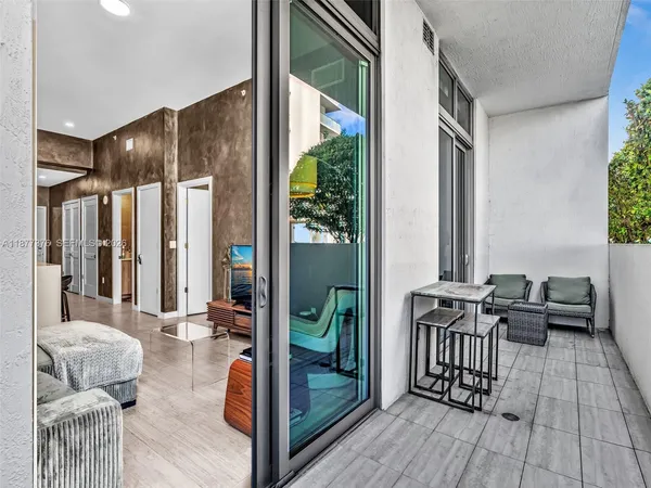 a bedroom with a bed and a table