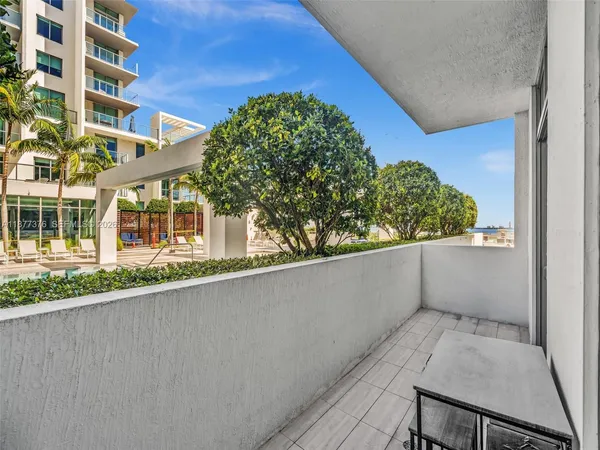 a view of walk in closet with clothes
