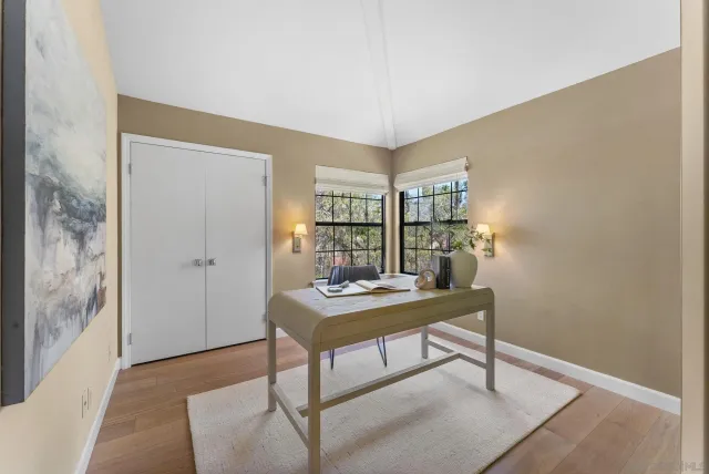 a view of a workspace with furniture