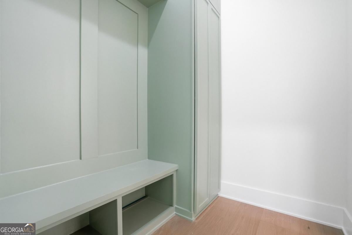 1557 Whitley Road Dacula, GA 30019 - Photo 37 of 46 a room with table and flowerpot