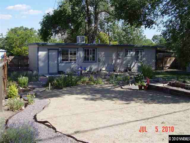 1925 Wilder Street Reno, NV 89512 - Photo 3 of 8 a front view of a house with garden