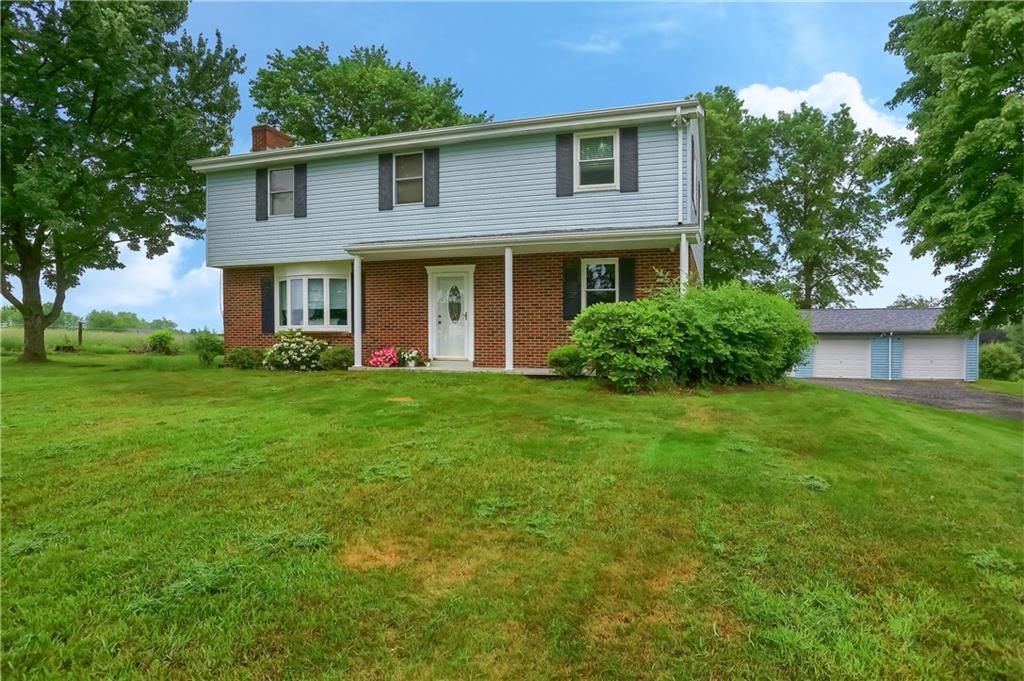 345 Beacon Road Renfrew, PA 16053 - Photo 3 of 44 a front view of a house with a yard