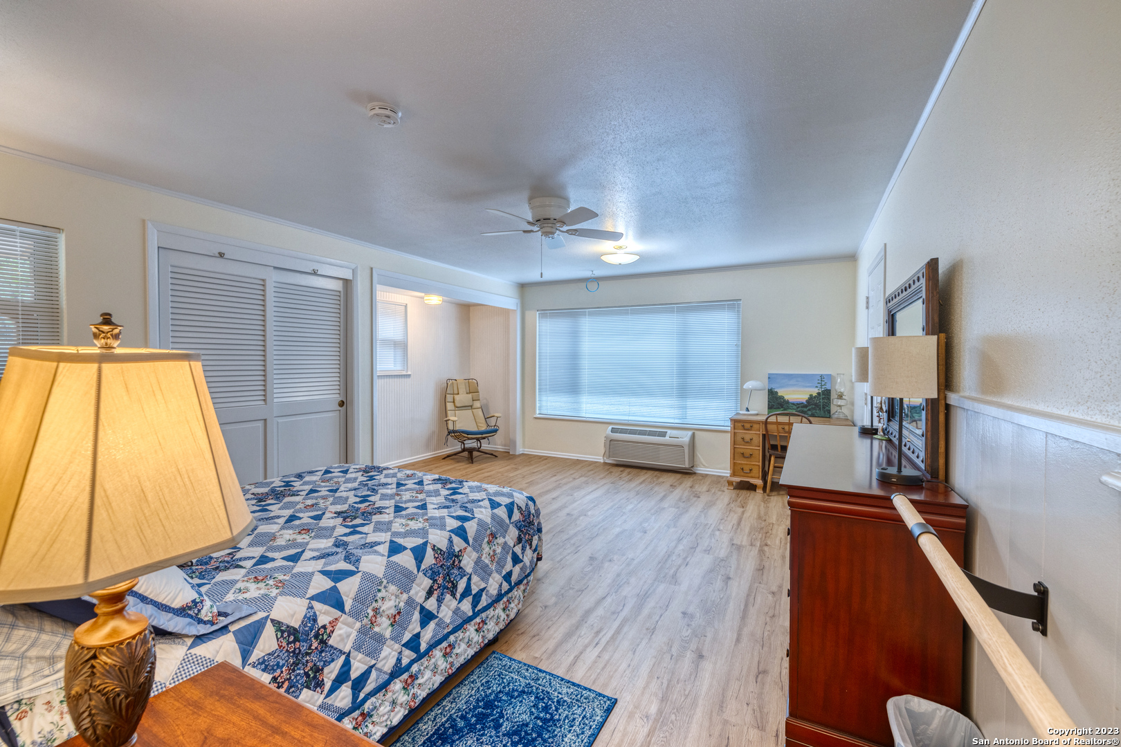 1482 Flatrock Circle Rio Frio, TX 78879 - Photo 18 of 34 a bedroom with a bed and wooden floor
