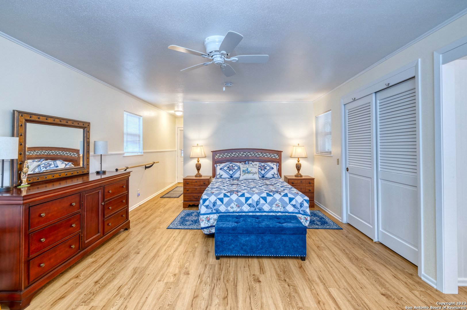 1482 Flatrock Circle Rio Frio, TX 78879 - Photo 19 of 34 a large bedroom with a bed and wooden floor