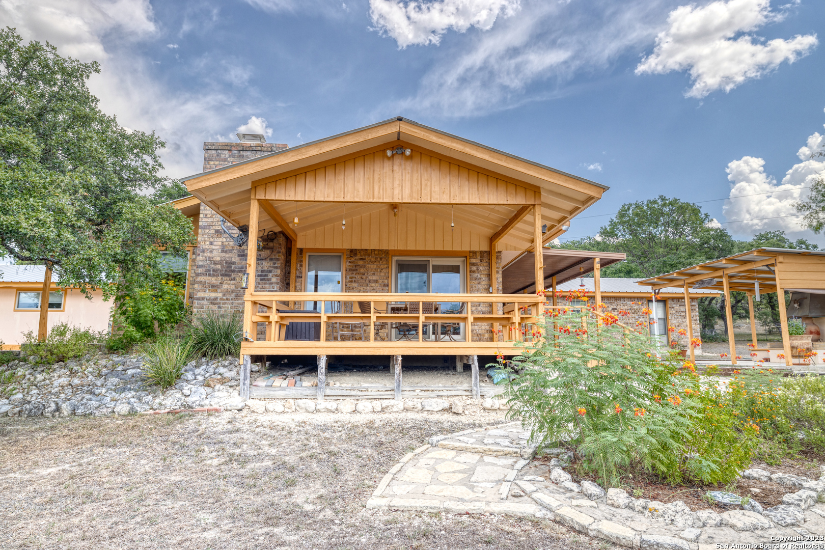1482 Flatrock Circle Rio Frio, TX 78879 - Photo 2 of 34 a view of house with outdoor space and sitting area