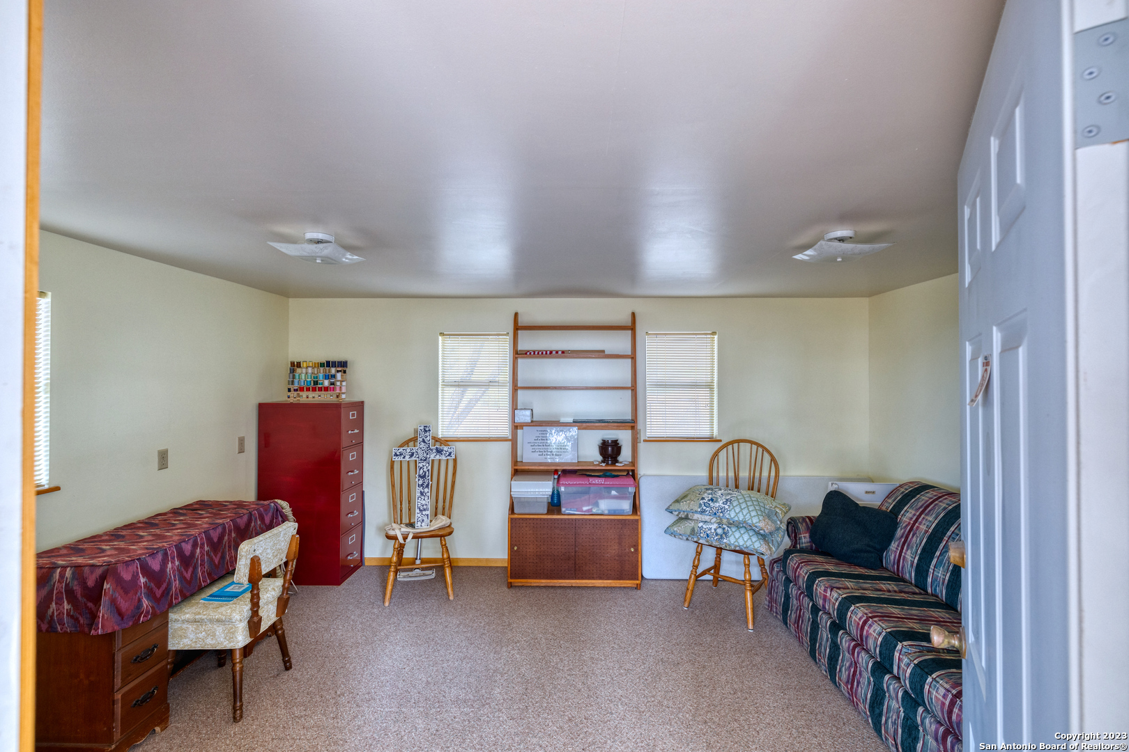 1482 Flatrock Circle Rio Frio, TX 78879 - Photo 23 of 34 a bedroom with furniture and a window