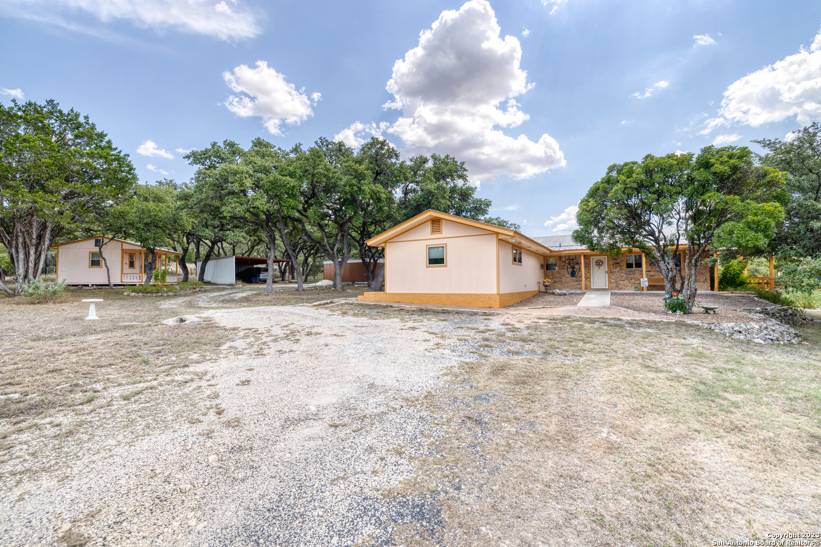 1482 Flatrock Circle Rio Frio, TX 78879 - Photo 25 of 34 a large tree in front of a house