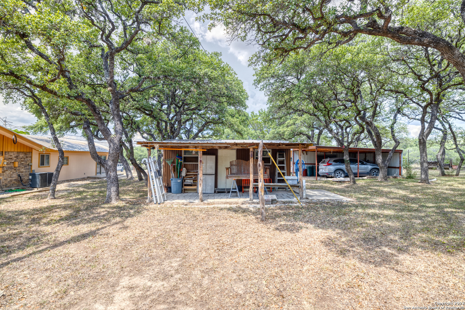 1482 Flatrock Circle Rio Frio, TX 78879 - Photo 28 of 34 a house with trees in the background