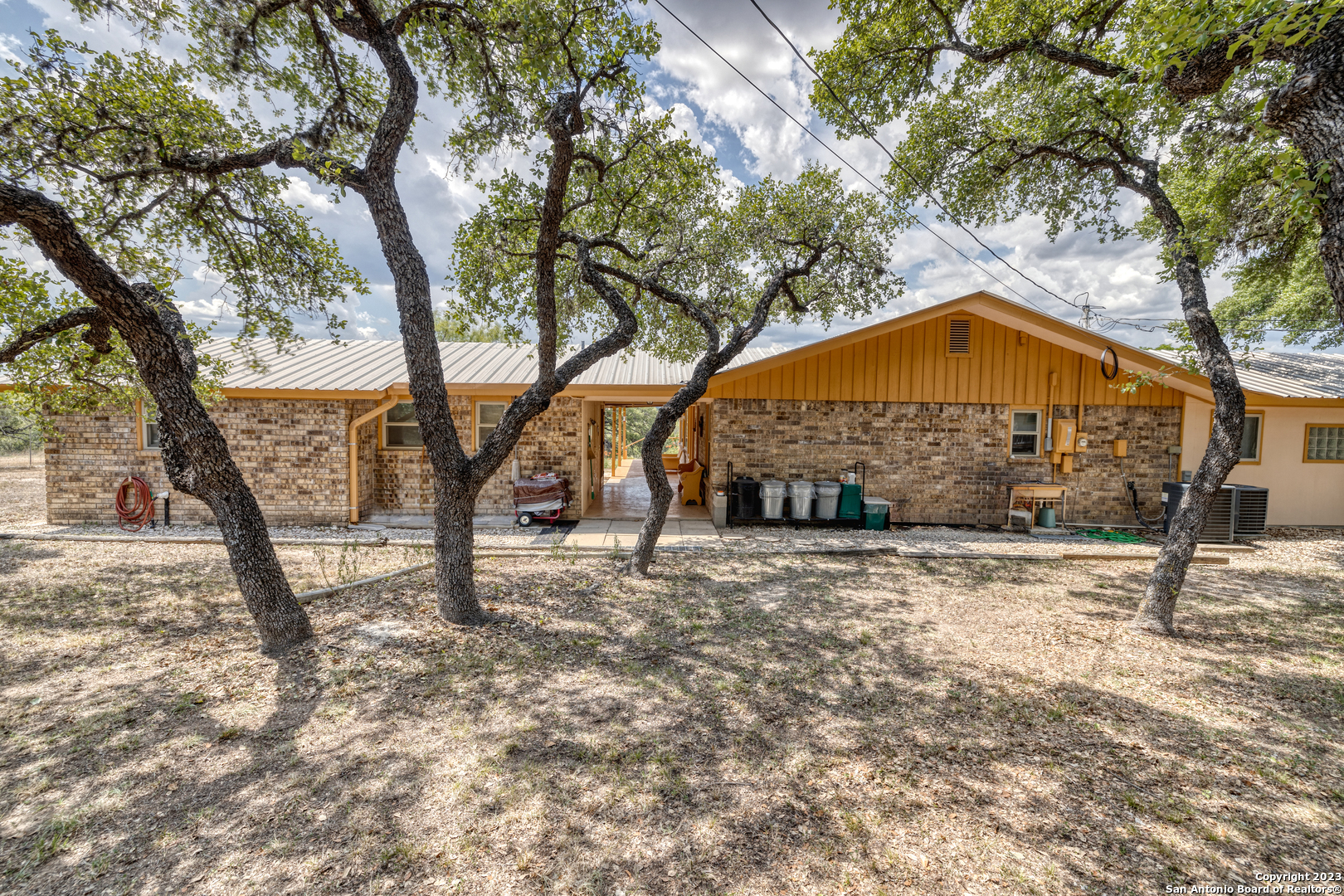 1482 Flatrock Circle Rio Frio, TX 78879 - Photo 29 of 34 a blue sign that is on the side of a road