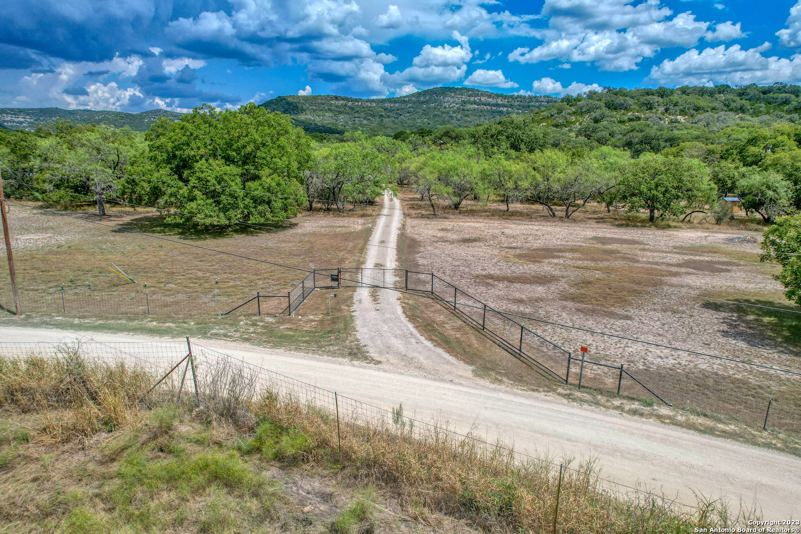 1482 Flatrock Circle Rio Frio, TX 78879 - Photo 30 of 34 a view of a yard with an trees