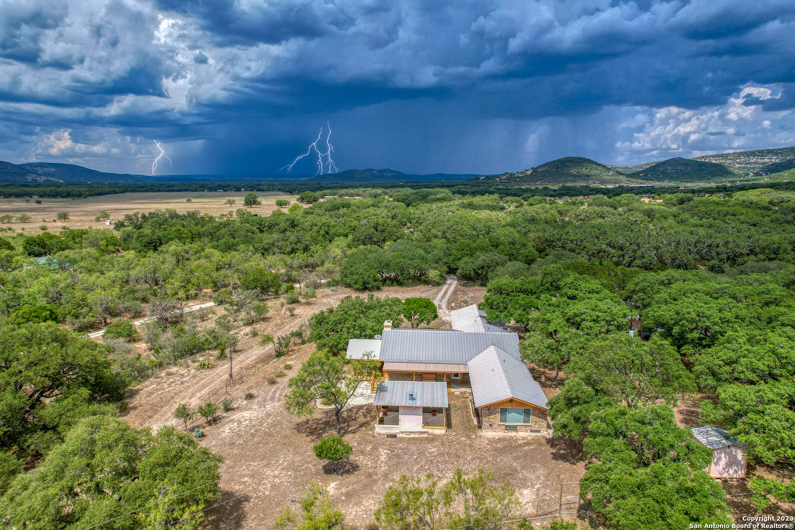 1482 Flatrock Circle Rio Frio, TX 78879 - Photo 31 of 34 a aerial view of a house with a yard