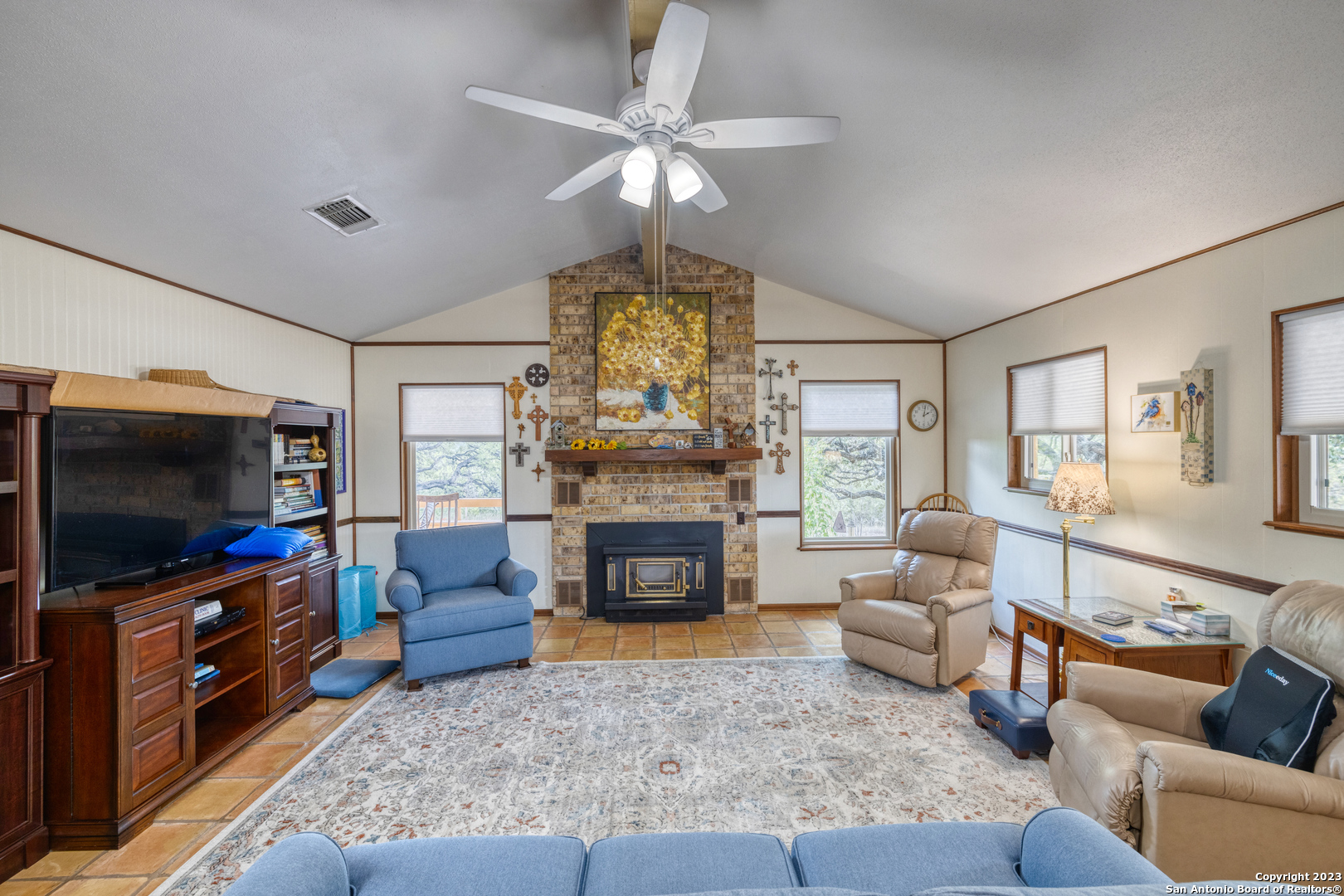 1482 Flatrock Circle Rio Frio, TX 78879 - Photo 5 of 34 a living room with furniture a flat screen tv and a fireplace