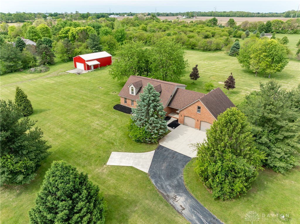 9981 Ridge Acres Lane Englewood, OH 45322 - Photo 2 of 73 This expansive estate offers a beautiful residence and a separate barn amidst lush green grounds.