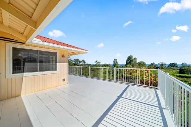 a view of a balcony with wooden floor