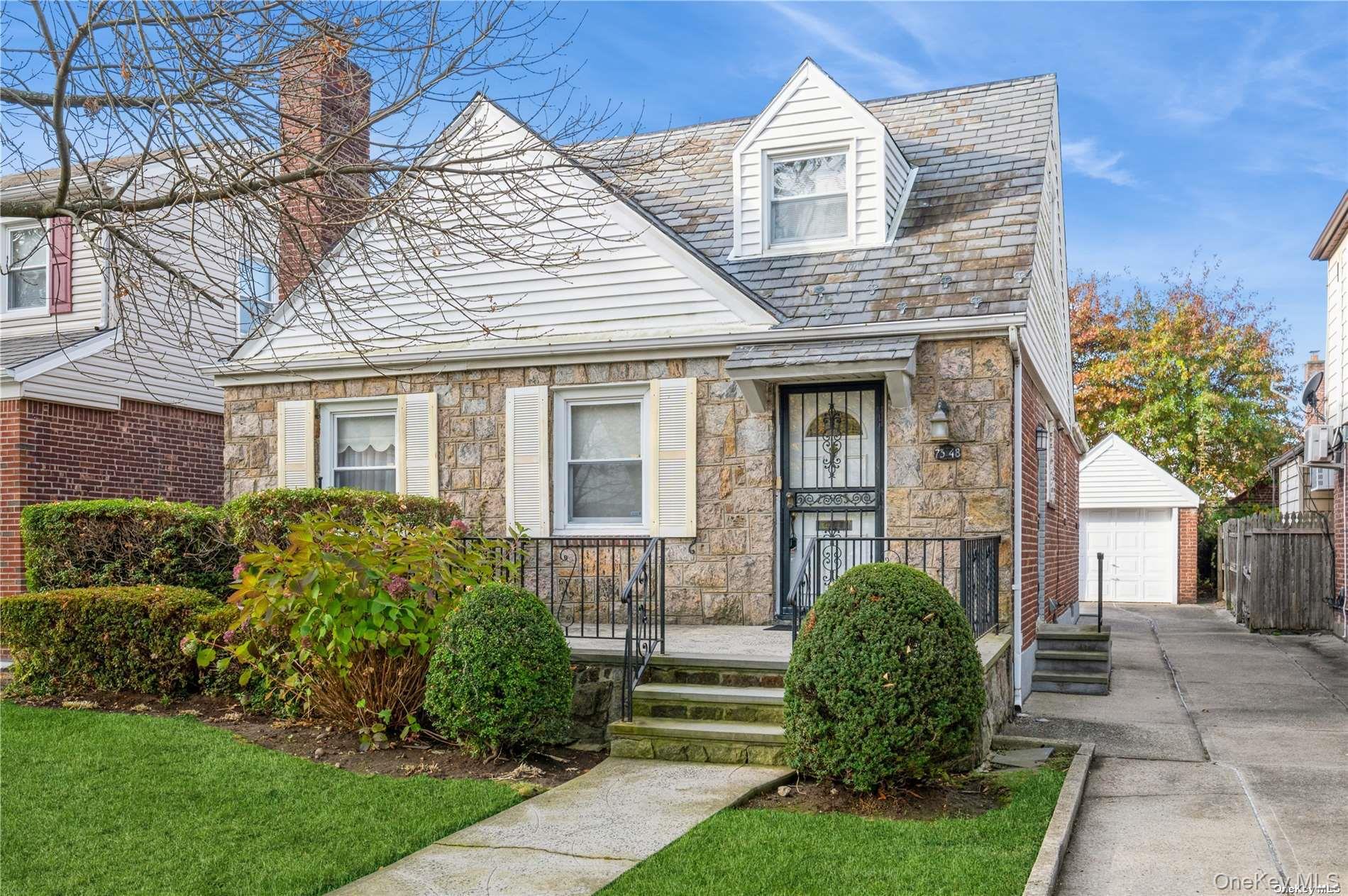 73-48 193rd Street Queens, NY 11366 - Photo 1 of 1 a front view of a house with a yard