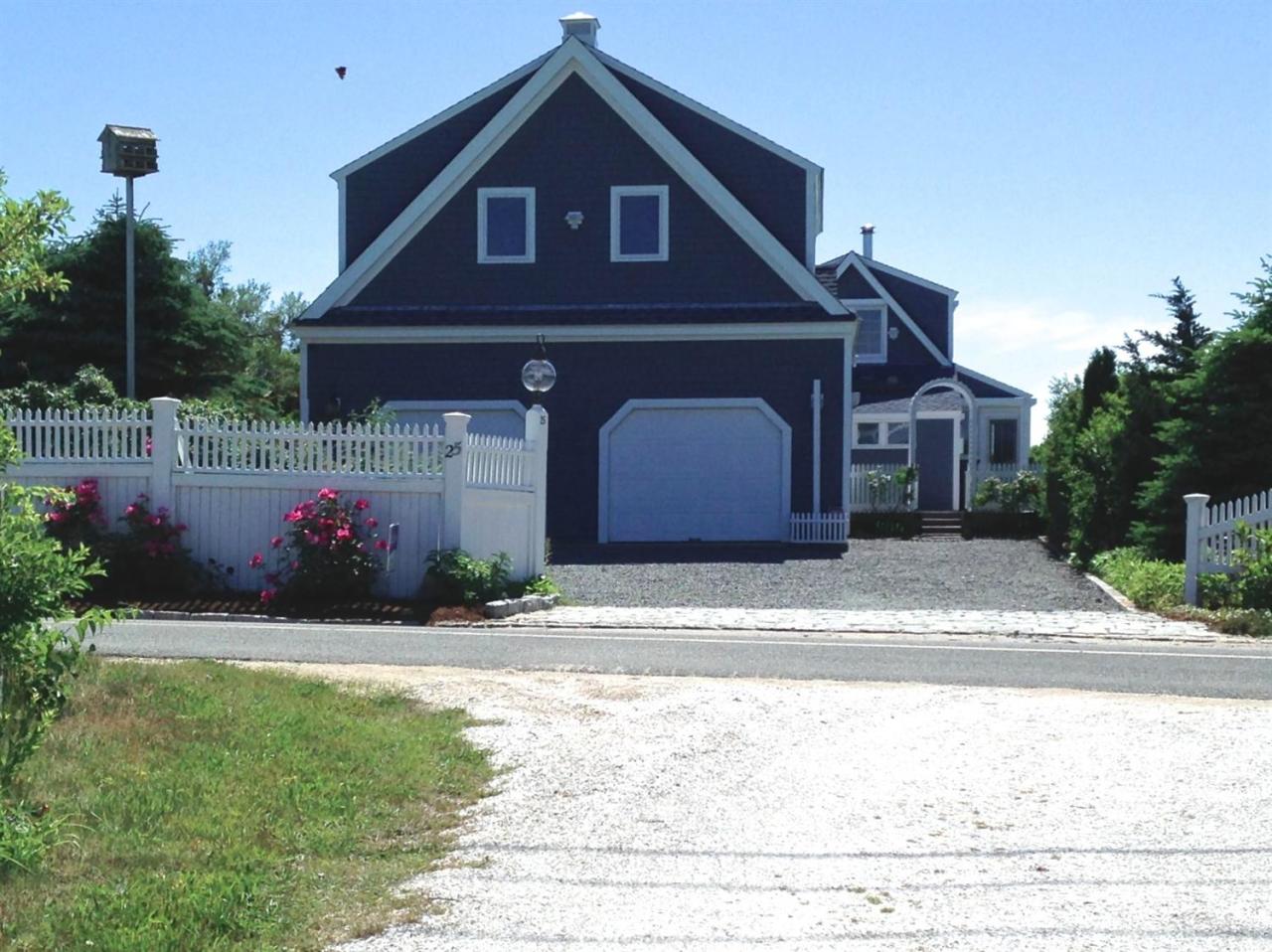 25 Bay View Road Truro, MA 02666 - Photo 5 of 21 a front view of a house with a yard