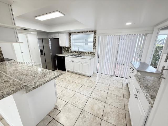 11570 Southwest 83rd Terrace Miami, FL 33173 - Photo 13 of 27 a kitchen with stainless steel appliances granite countertop a sink stove and cabinets