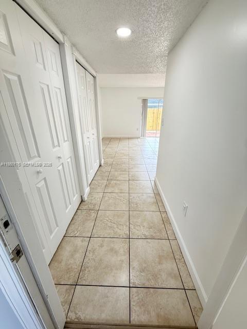 11570 Southwest 83rd Terrace Miami, FL 33173 - Photo 8 of 27 a hallway with a black white checkered floor