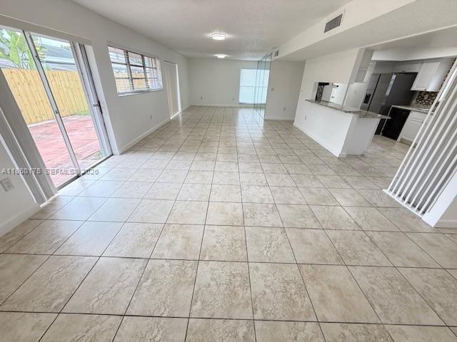 11570 Southwest 83rd Terrace Miami, FL 33173 - Photo 10 of 27 a view of an empty room and a window