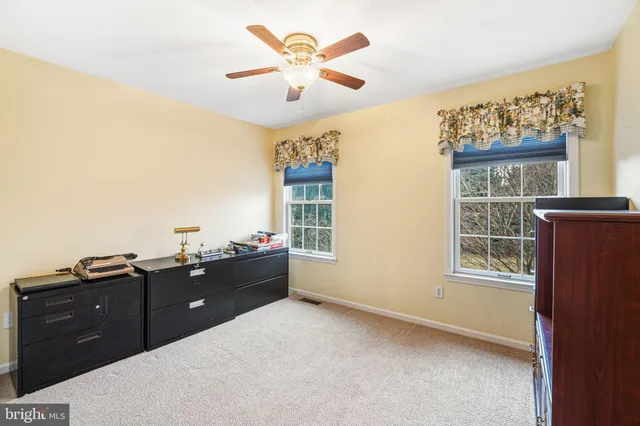 a room with a bed and a window