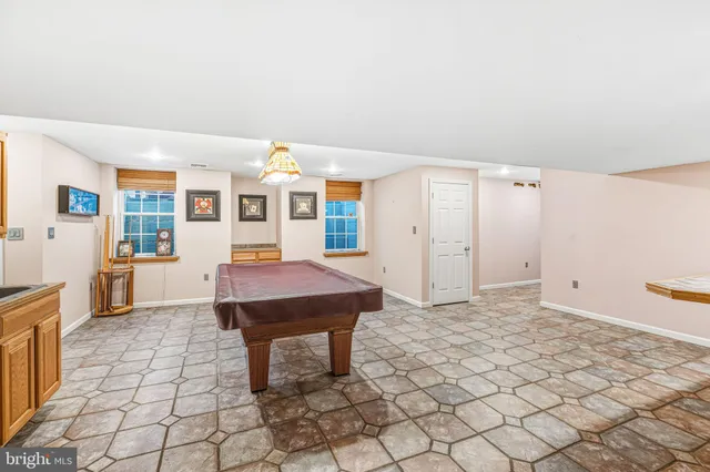a living room with a table and chairs