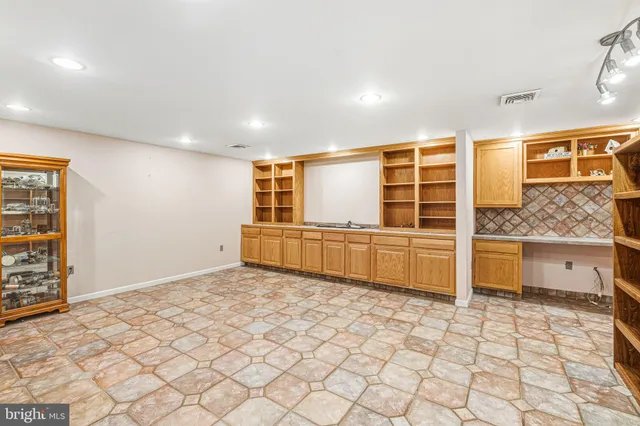a view of a bathroom with a sink and a window