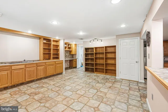 a view of empty room with wooden walls