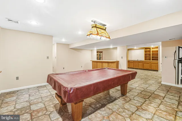 a view of a chairs and table in the balcony