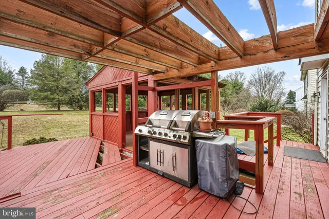 a view of a white house with a yard and plants