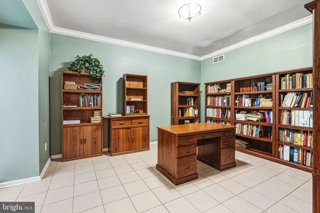 a room with furniture and book shelf