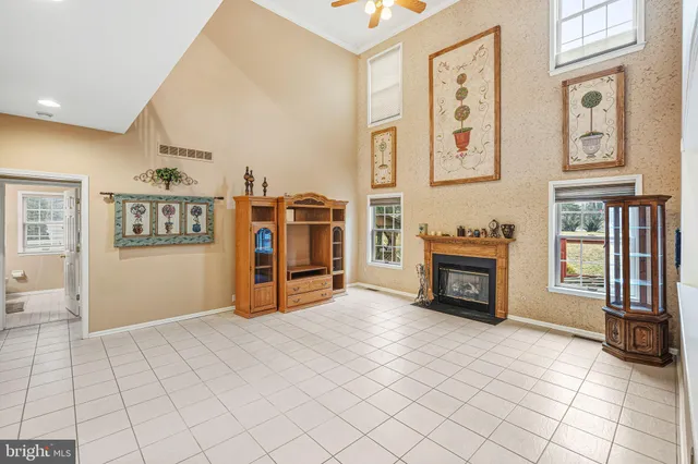 a view of a livingroom with furniture and an empty room