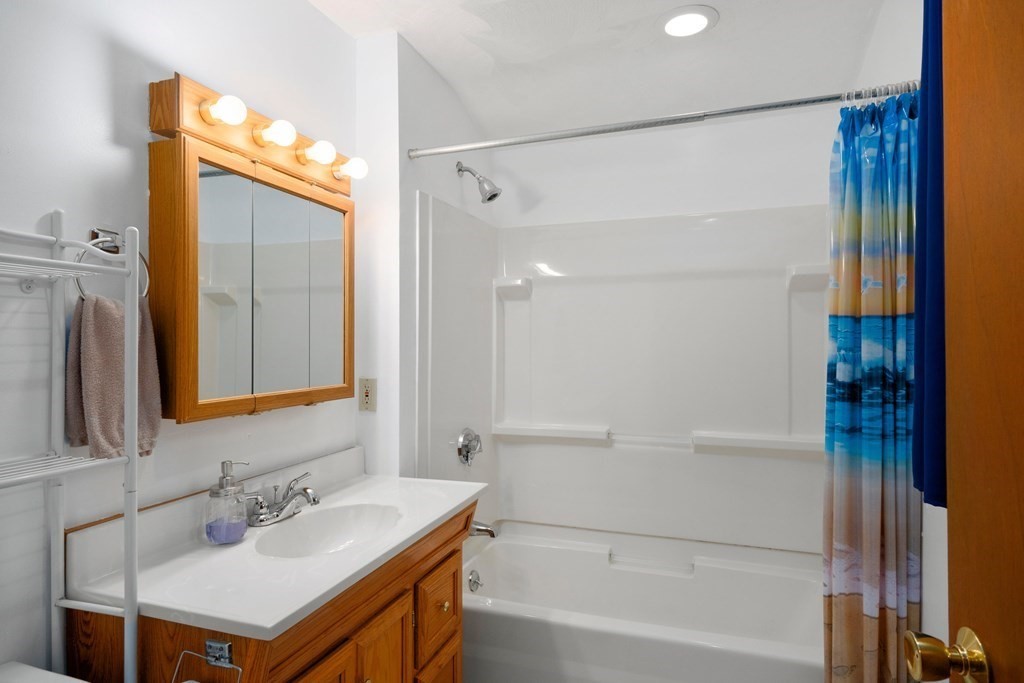 102 Orange Street Reading, MA 01867 - Photo 18 of 23 a bathroom with a sink and a mirror