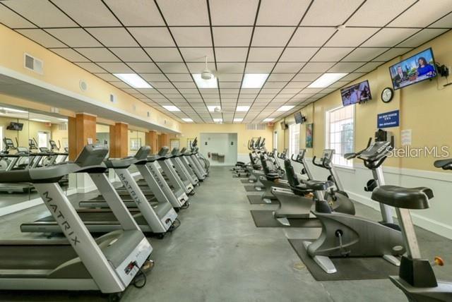 3403 Greenwich Village Boulevard, Unit 203 Orlando, FL 32835 - Photo 12 of 16 a view of a room with gym equipment