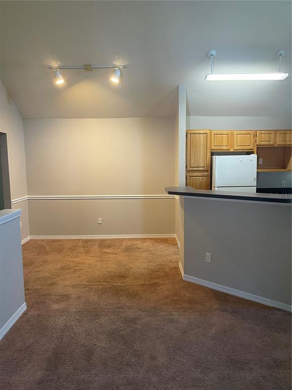 3403 Greenwich Village Boulevard, Unit 203 Orlando, FL 32835 - Photo 5 of 16 a view of a room with a kitchen