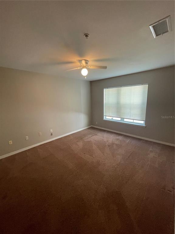 3403 Greenwich Village Boulevard, Unit 203 Orlando, FL 32835 - Photo 9 of 16 a view of an empty room with a window