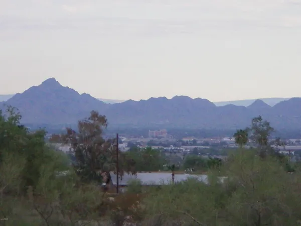 a view of a town with mountains in the background
