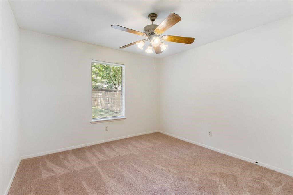 2106 Wickburn Drive Spring, TX 77386 - Photo 11 of 18 an empty room with window and fan
