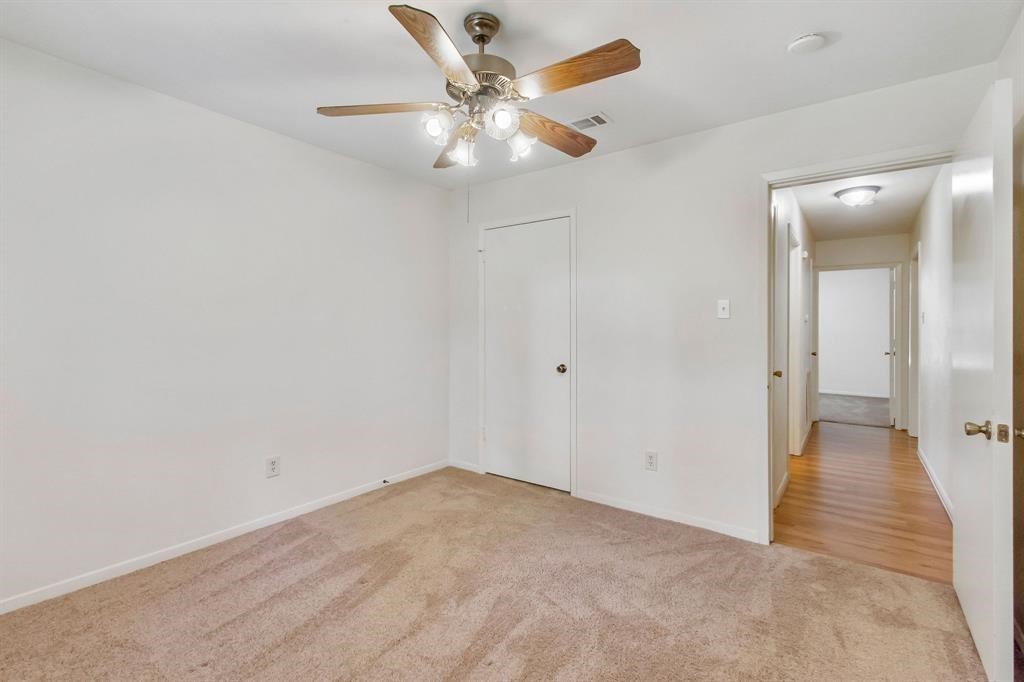 2106 Wickburn Drive Spring, TX 77386 - Photo 12 of 18 an empty room with fan and a ceiling fan