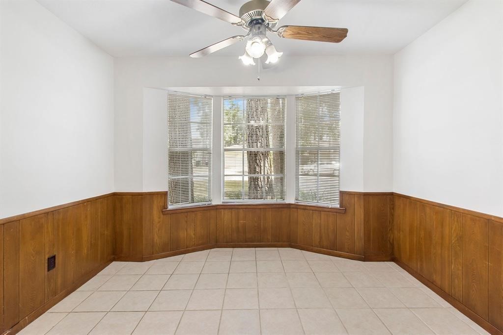 2106 Wickburn Drive Spring, TX 77386 - Photo 18 of 18 an empty room with windows and fan