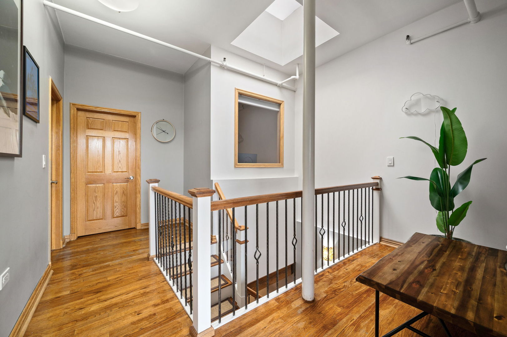 1101 West Armitage Avenue, Unit 204 Chicago, IL 60614 - Photo 14 of 17 a view of a hallway with wooden floor and stairs